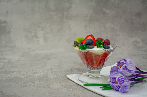 quinoa chia seeds dessert with almonds milk strawberry raspberry blueberry kiwi fresh mint napkin