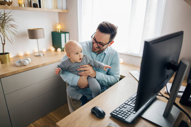 istock Young father working from home and babysitting his baby boy in the same time. 1215566770
