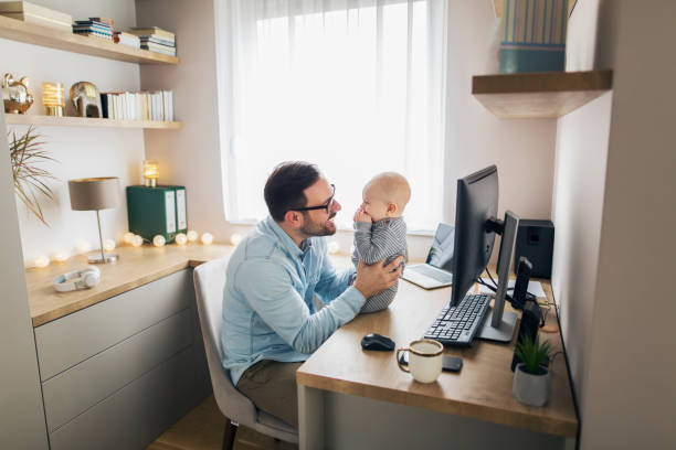 istock Young father working from home and babysitting his baby boy. 1215566775