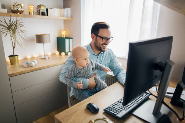 istock Young father working from home and babysitting his baby boy in the same time. 1215566789