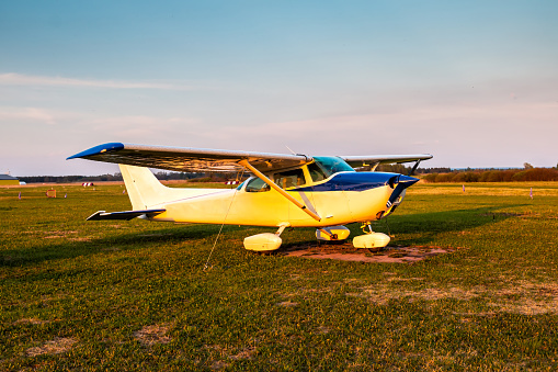 Small private aircraft on the airfield in the evening light
