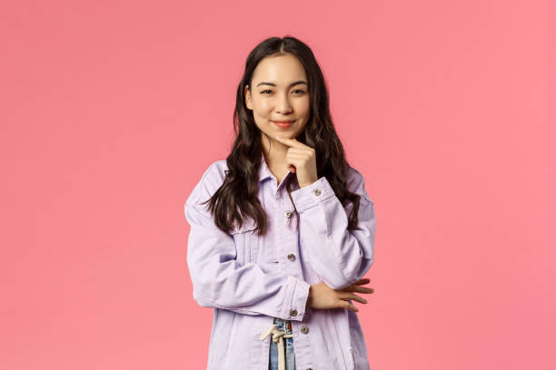 istock Thoughtful and creative, sassy pretty woman have interesting idea, prepared great plan, smile squinting as made-up great thought, scheming, standing pink background 1215568232