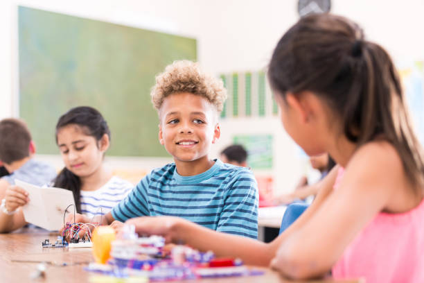 istock Group of Elementary School Students Learning Circuits stock photo 1215569661