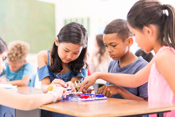 istock Group of Elementary School Students Learning Circuits stock photo 1215569665