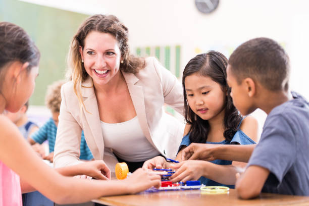 istock Group of Elementary School Students Learning Circuits stock photo 1215569666