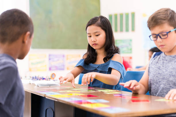 istock Group of Elementary School Students Learning in Class stock photo 1215569669