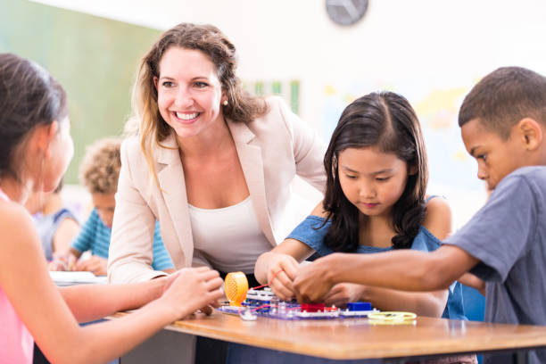istock Group of Elementary School Students Learning Circuits stock photo 1215569670