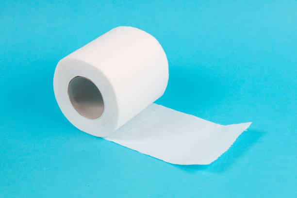 istock white toilet paper roll on blue background 1215569806