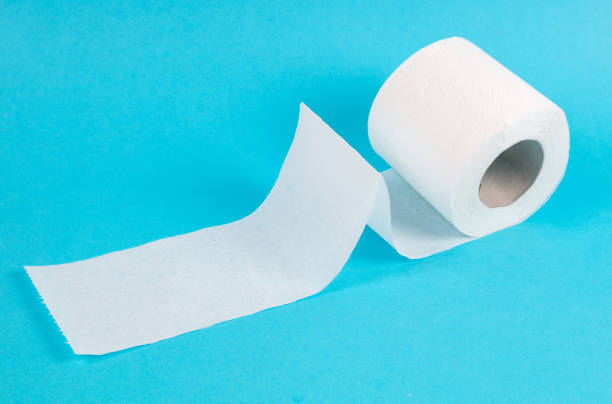 istock white toilet paper roll on blue background 1215569838