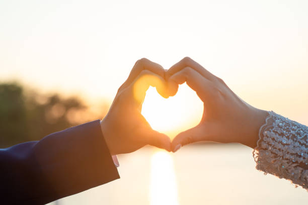 istock Women and men hold hands in the evening 1215569913