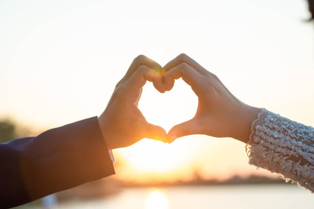 istock Women and men hold hands in the evening 1215569953