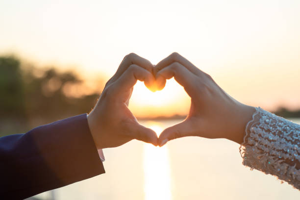 istock Women and men hold hands in the evening 1215569978
