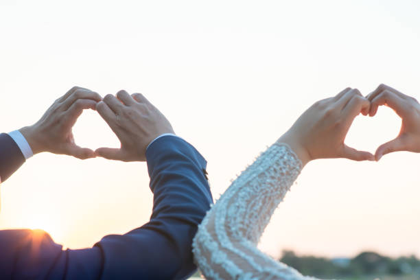 istock Women and men hold hands in the evening 1215569981