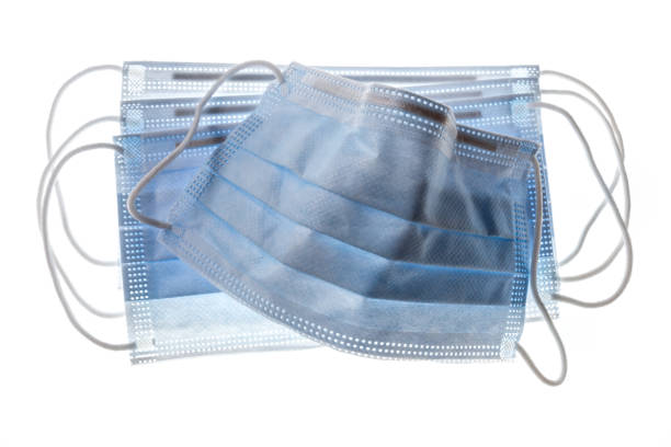 istock blue medical face masks isolated on white background 1215570856