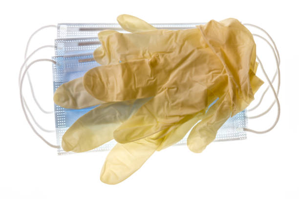 istock yellow latex surgical gloves with surgical face mask 1215570875