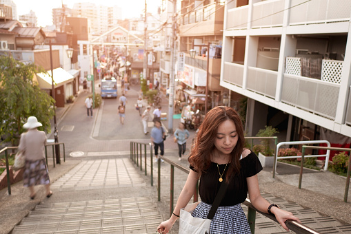 Young asian woman visiting travel destinations in Yanesen area, Tokyo