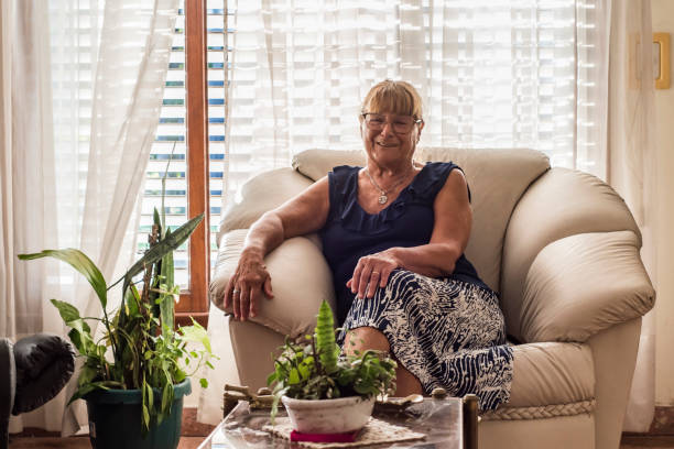 istock older woman spends her days in quarantine resting at home 1215572437