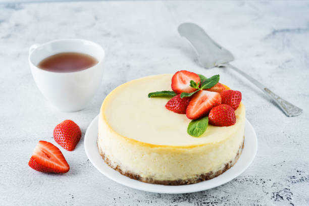 istock Cheesecake with fresh strawberries and mint leaves 1215572780