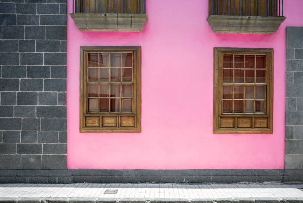 istock Pink painted building wall in stone frame. 1215572831