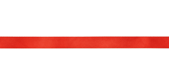 Red silk ribbon close up. Isolated on white background