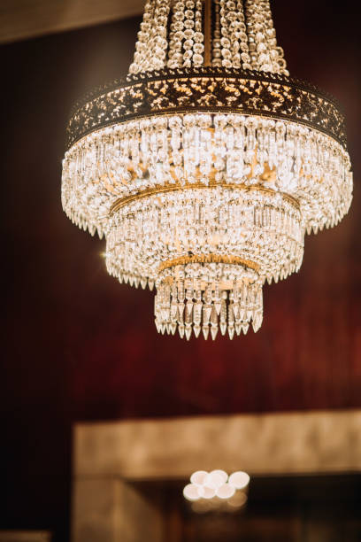 istock big crystal chandelier hanging inside red room 1215575237