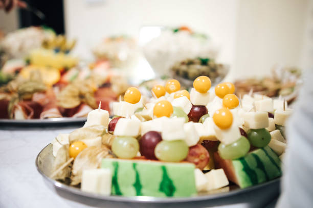 canape with grape and fruits on appetizer buffet table for wedding, party or birthday