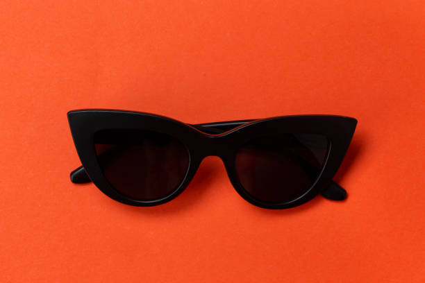istock Fashionable sunglasses on an orange background. 1215575511