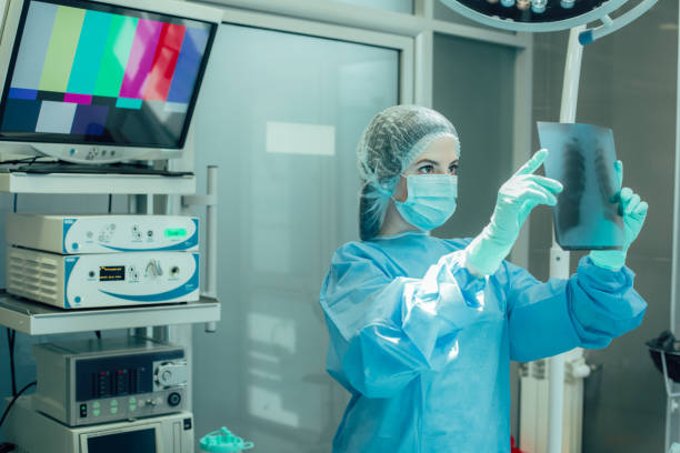 istock Serious doctor analyzing x ray results stock photo 1215577257