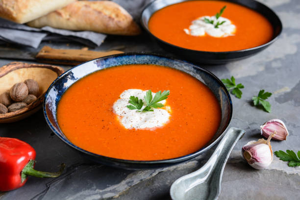 istock Creamy roasted red bell pepper soup with sour cream 1215581299