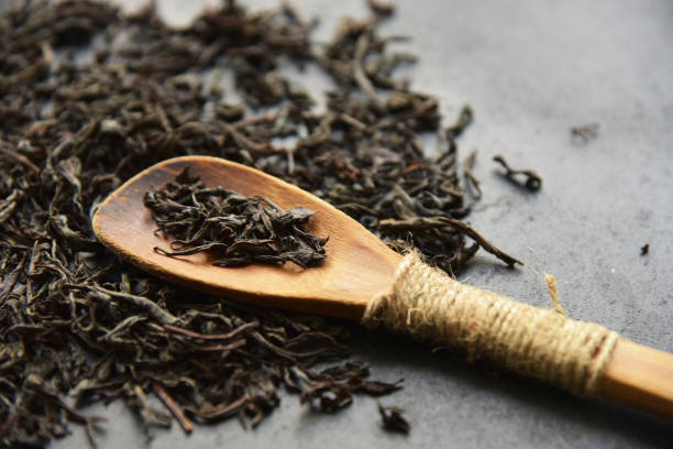 istock Herbal wellness dry tea in wooden spoon 1215581462