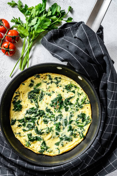 istock Italian Spinach and Cheese Omelet.  Gray background. Top view 1215582717