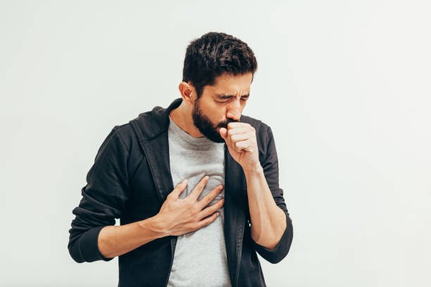 病気の男は彼の手の上に咳をします。コロナウイルス、コーヴィッド-19コンセプト - coughing illness men latin american and hispanic ethnicity ストックフォトと画像