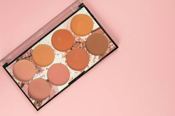 istock Colorful shades for make-up stand on a pink table. Top views 1215586131