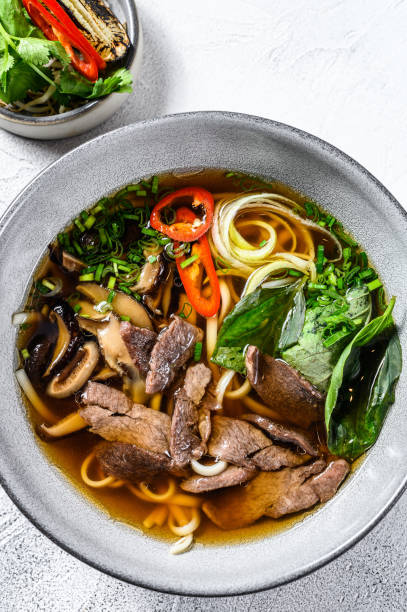 istock Pho Bo vietnamese Soup with beef. White background. Top view 1215588483