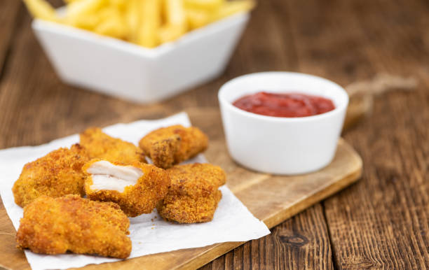 istock Homemade Chicken Nuggets on vintage background 1215588902