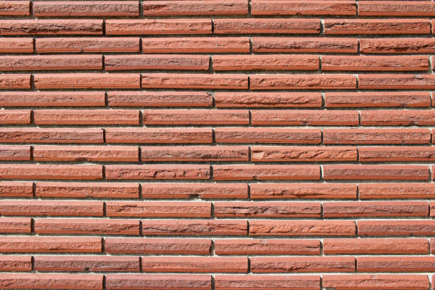 istock Vintage red brick wall background with striped textured bricks in 1/3 offset pattern 1215589565
