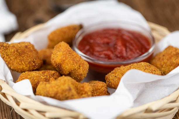 istock Vintage wooden table with fresh made Chicken Nuggets 1215589824
