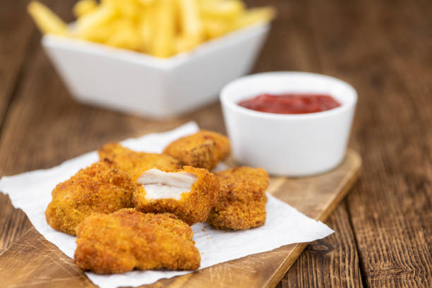 istock Vintage wooden table with fresh made Chicken Nuggets 1215589844