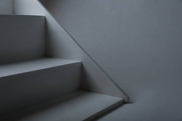 istock white plywood stairs on a gray background 1215590672