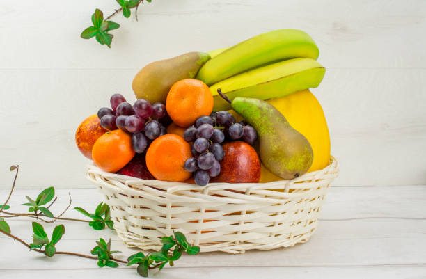 istock fruit on white background pears, oranges , grapes , apple , melon ,mandarin 1215593962