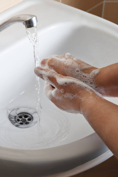 istock Washing hands with soap, hygiene 1215594114