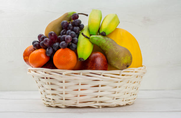 istock fruit on white background pears, oranges , grapes , apple , melon ,mandarin 1215594755