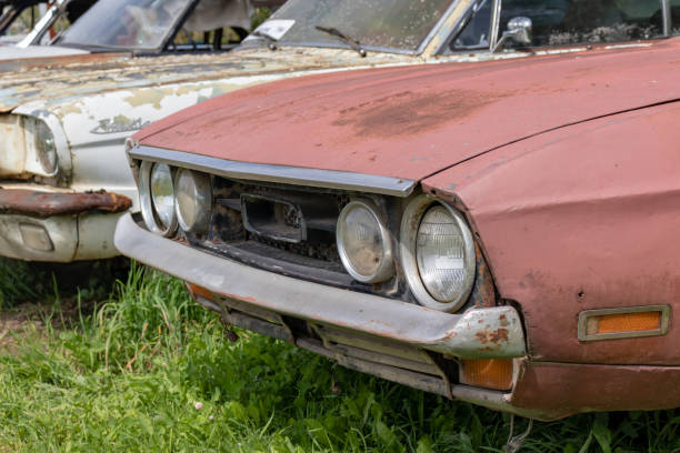 istock Old abandoned rusty vehicles, crushed cars in scrapyard, junk yard needed to be utilised and reused to protect nature and environment, metal recycling concept 1215600384