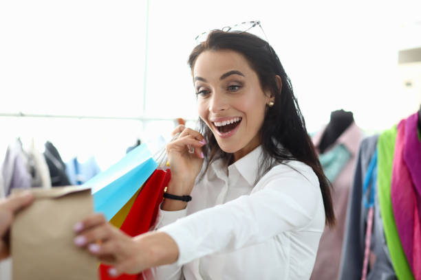 istock Nice girl rejoices at package that she is handed 1215602236