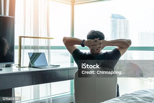 istock Life-work balance and city living life style concept of business man relaxing, take it easy in office room resting with thoughtful mind thinking of lifestyle quality looking forward to cityscape 1215602351