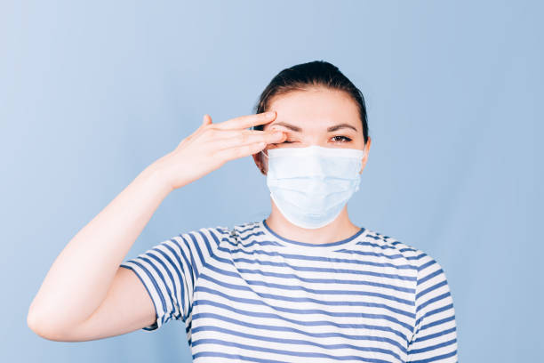 istock girl touches face 1215602581