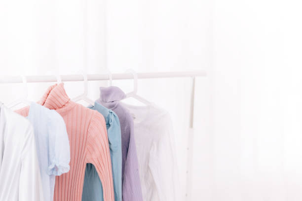 istock clothes hanging on hangers 1215602671
