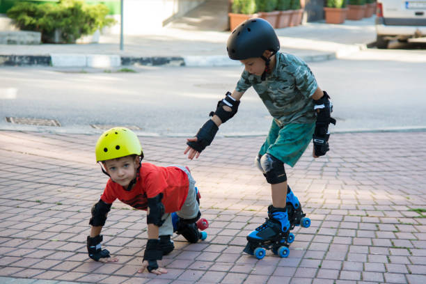 istock Children roller skate in the park 1215602770