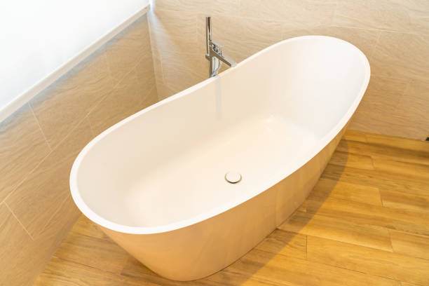 istock Clean white empty bathtub decoration interior 1215605226