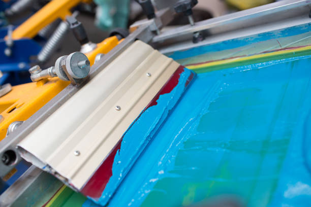 istock Silk screen printing. Serigraphy. Color paints and fabric. Plastisol paint and squeegee. 1215606044